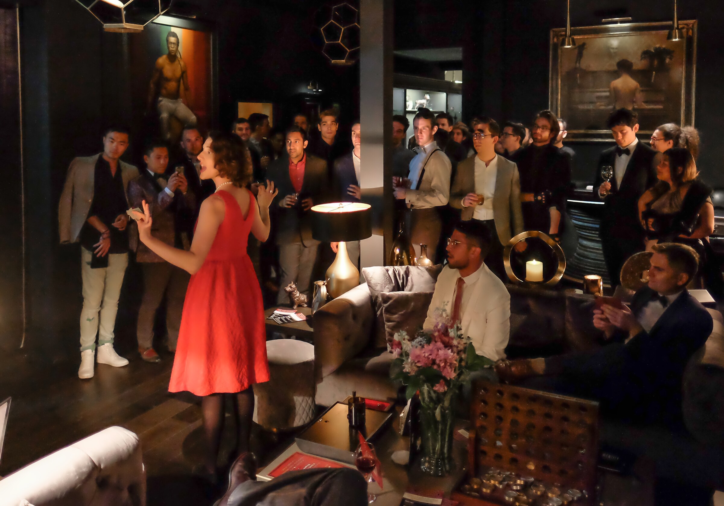 Rebecca Power addressing a room of guests at a production of The Racket