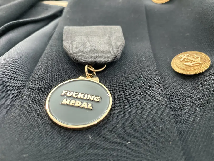 Fucking Medal pinned to a lapel