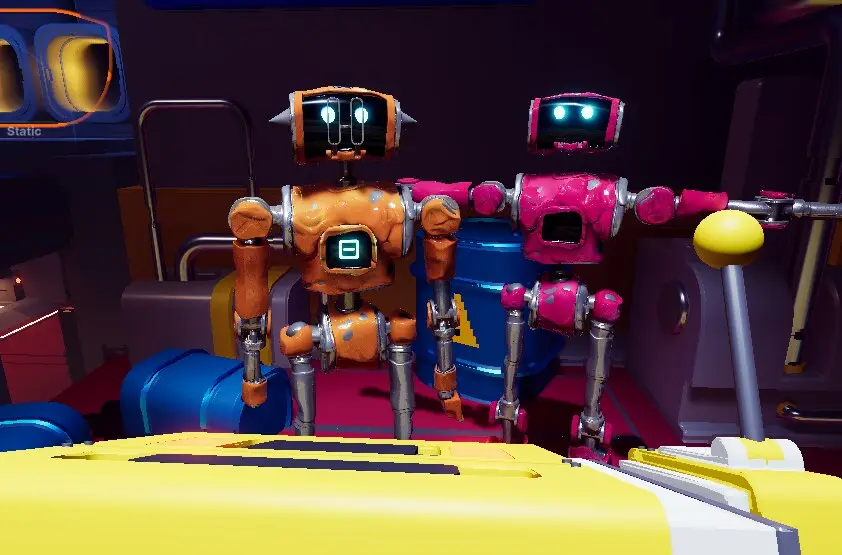 Two robot characters, one orange and one pink, in a cluttered interior